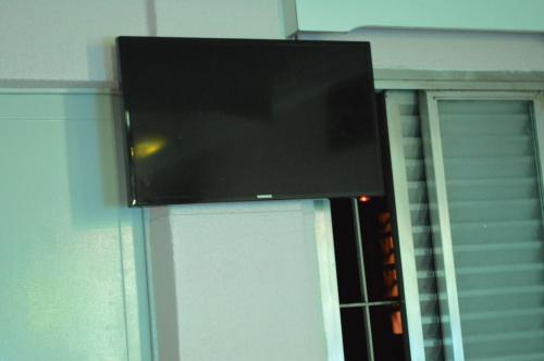 Holliday Norte Hotelにあるテレビまたはエンターテインメントセンター