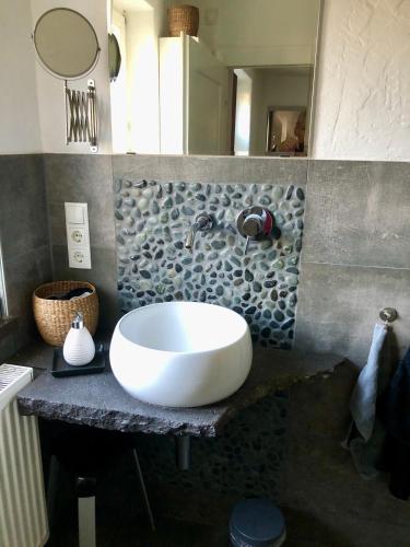 a bathroom with a large white sink on a counter at Ferienhaus Eifel-Auszeit in Rieden