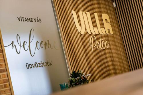 a mirror in a room with the words vline and viola at Villa Potôň 2023 in Horná Potôň