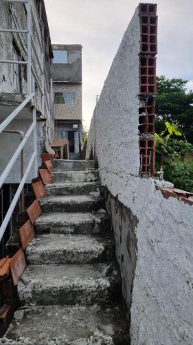 a set of stairs next to a building at Apto em Itaparica condomínio in Itaparica Town
