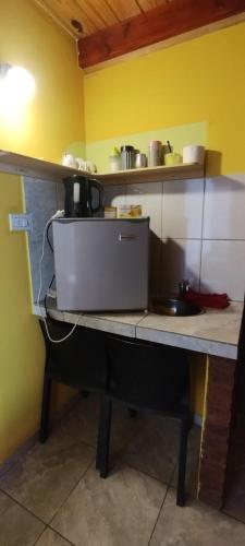 a counter in a kitchen with a laptop on it at Ariel in Gobernador Gregores