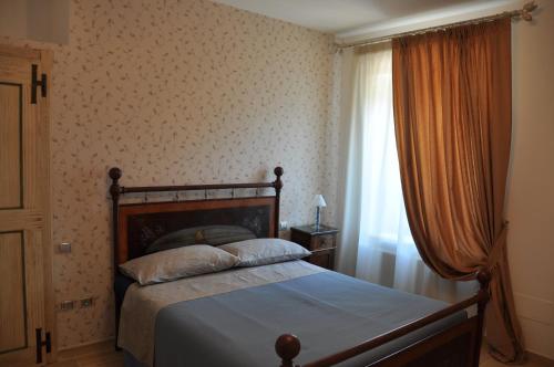 Postel nebo postele na pokoji v ubytování Res Nova Il Colle