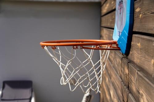 a basketball hoop attached to a wall at Rosen Villa at Ramat Hahayal in Tel Aviv