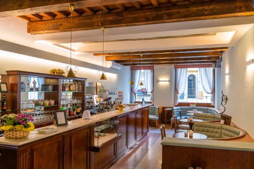 a restaurant with a bar in a room at Albergo Falterona in Stia