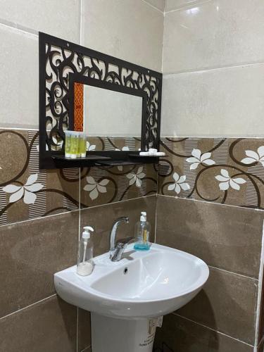 a bathroom with a sink and a mirror on the wall at Magic nature camp in Wadi Rum