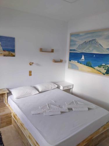 Postel nebo postele na pokoji v ubytování Kalymnos Platy Gialos Mousellis Makis Apartments