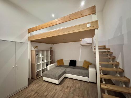 a bedroom with a bunk bed and a staircase at S6 - APARTMENT PROMO next to gozsdu garden in Budapest