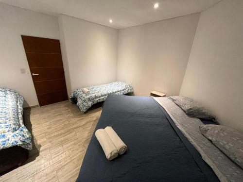 Katil atau katil-katil dalam bilik di Canning House - Ezeiza Airport