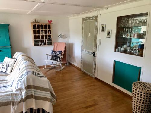 a room with a bed and a green cabinet at LaTerestone in Les Bayards