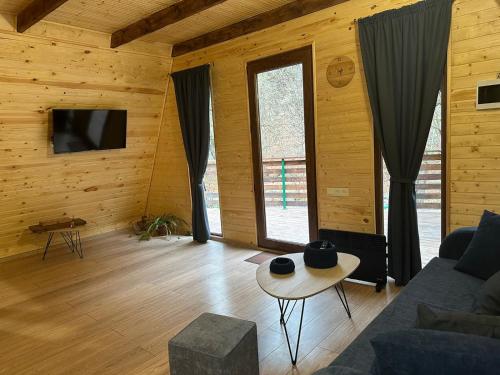 a living room with a couch and a table at Apinn_Guesthouse in Dilijan
