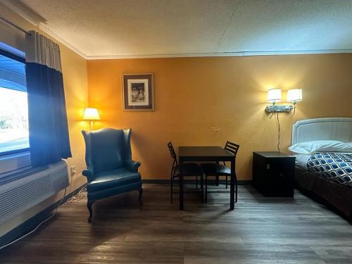 Letto o letti in una camera di Loyalty Inn Rockingham