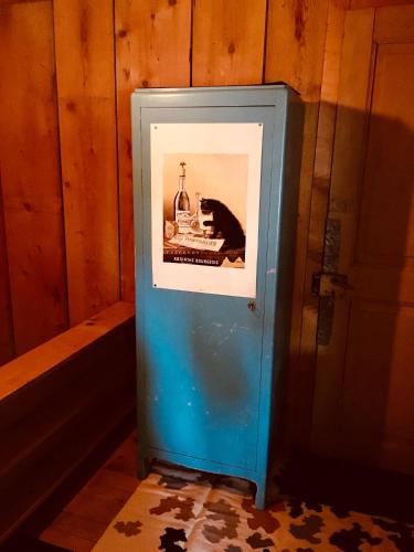 a picture in a frame in the corner of a room at LaTerestone in Les Bayards