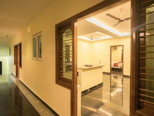 a hallway of a home with a ceiling fan at Hotel Elite Park in Tirupati