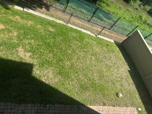 an overhead view of a yard with grass and a fence at Angel’s Nest Nelspruit in Nelspruit