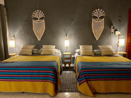 Katil atau katil-katil dalam bilik di Itzé Hostel Boutique - Progreso