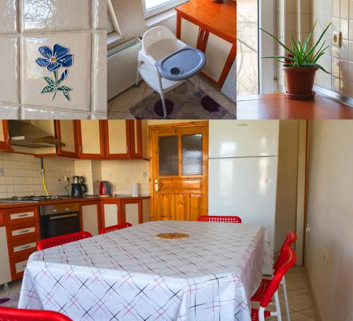 cocina con mesa y sillas rojas en una habitación en Beyaz Konak Pansiyon 2 en Gülşehir