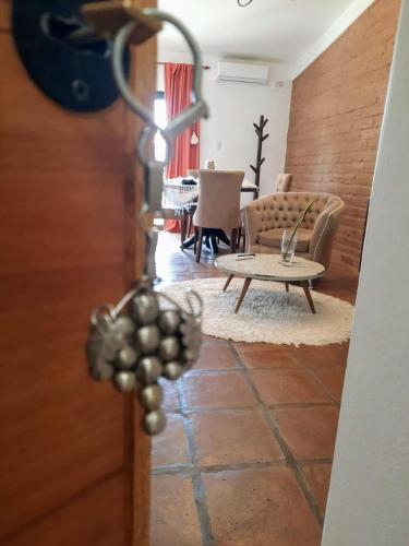 a view of a living room with a table and chairs at Luna de Cafayate Hotel Boutique in Cafayate