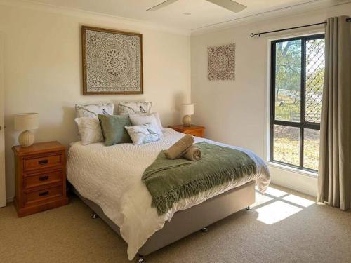 A bed or beds in a room at Balmurray House