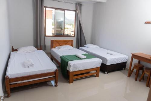 A bed or beds in a room at Humazapa