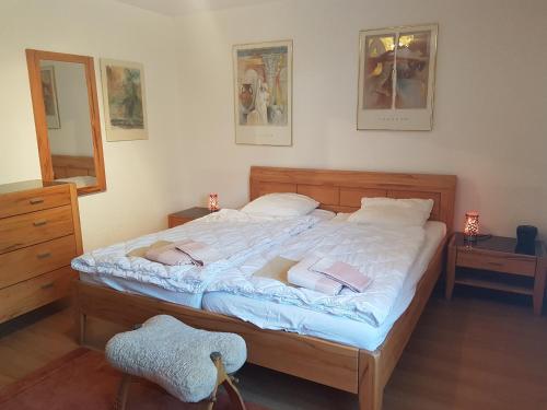 a bedroom with a large bed with two pillows at Stgirat (356 Ac) in Valbella