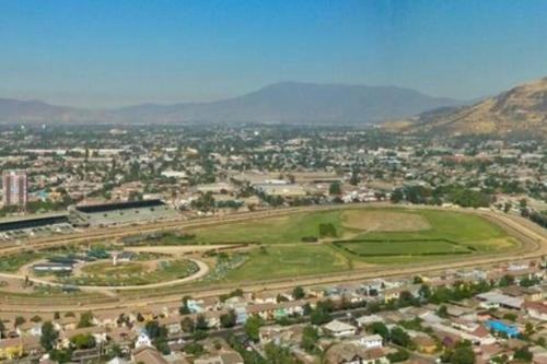 an aerial view of a city with mountains in the background at 8 Apartamento en Santiago en fente al Metro - Hipodromo de Chile y Estadio San Laura in Santiago