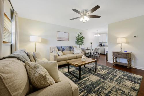 a living room with a couch and a table at Downtown Hillsborough Duplex in Hillsborough