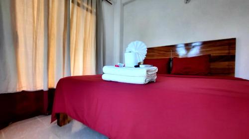 Katil atau katil-katil dalam bilik di Cataviento Hotel