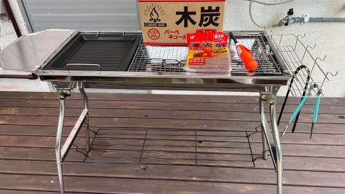 a grill sitting on top of a table at Okinawa Naha JinJin -沖縄伝統体験型宿じんじん- in Naha