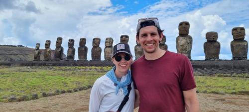 a man and a woman standing in front of an easel at Villa Maori Tea Rapa Nui, Easter Island with ocean view in Hanga Roa