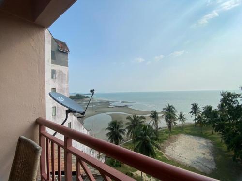 a balcony with a view of the ocean at Paradise Lagoon Apartment South in Port Dickson
