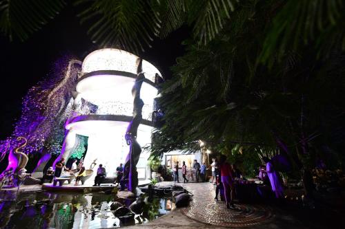 a group of people standing around a fountain at night at Phoenix 1F 鳳凰城堡1Ｆ場地出租 in Chenggong