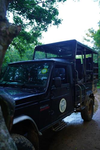 a black jeep parked on a dirt road at Yala Wild House in Yala
