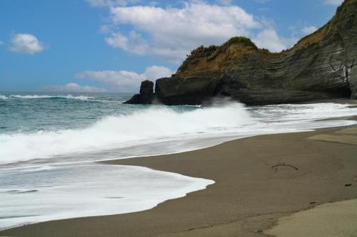 a beach with waves crashing on the shore at 鳳凰城堡2F in Chia-p'ing