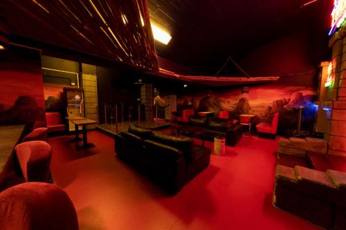 a room with couches and chairs in a theatre at FDTD Party & Sauna Lounge in Lahti