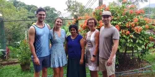 a group of people standing in front of a garden at Mount View in Polonnaruwa