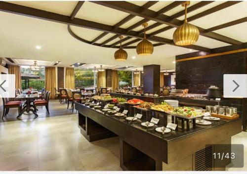 a buffet in a hotel room with a lot of food at Aloha Apartments by blissful Ganges in Rishīkesh
