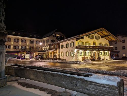 a group of buildings on a street at night at Ferienwohnung Jodlschmid in Ruhpolding