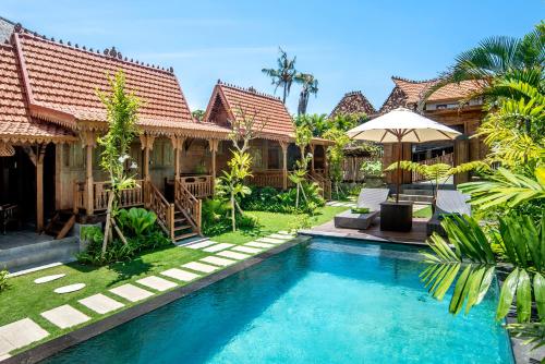 an image of a villa with a swimming pool at PNB Bali Villas in Canggu