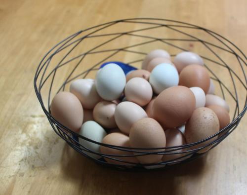 a basket of eggs sitting on a table at グリーンハウス in Nanjo