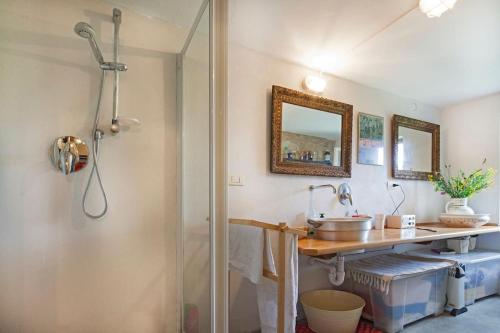 a bathroom with a shower and a sink at Cottage a Bossolasco con piscina in Niella Belbo