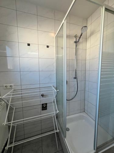 a shower with a glass door in a bathroom at Feel like Home 2 in Biberach an der Riß