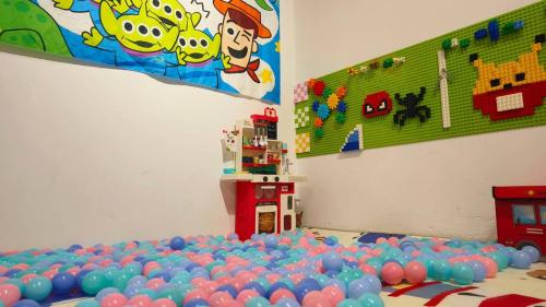 a room with a bunch of balls on the floor at Warisan Homestay 18pax Kota Kinabalu in Kota Kinabalu