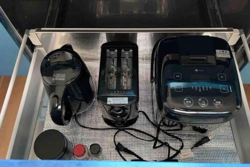 a drawer with various electronics in a box at Sound Garden Biei - Forest suite in Biei