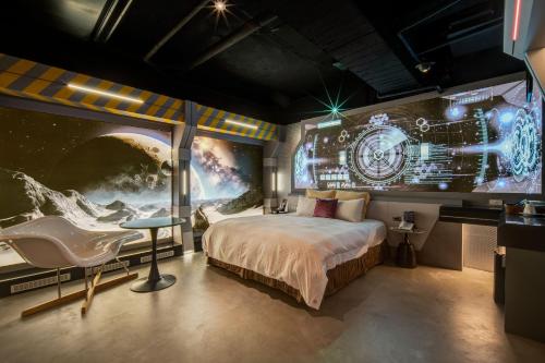 a bedroom with a bed and a large screen at Merry Day Motel Zhonghe Branch in Zhonghe