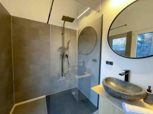a bathroom with a sink and a mirror at Nordic Harmony Home - Prignitz 
