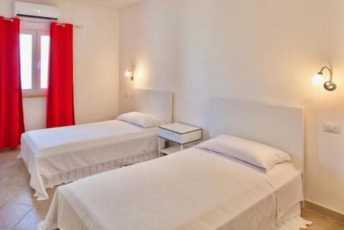 Ένα ή περισσότερα κρεβάτια σε δωμάτιο στο Apartments in residence with swimming pool in Porto Rotondo