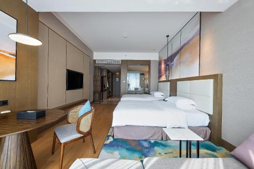 Krevet ili kreveti u jedinici u objektu Crowne Plaza Beihai Silver Beach, an IHG Hotel