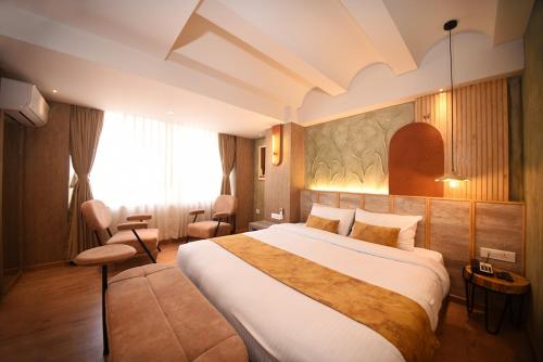 Daali Hotel & Apartmentにあるベッド