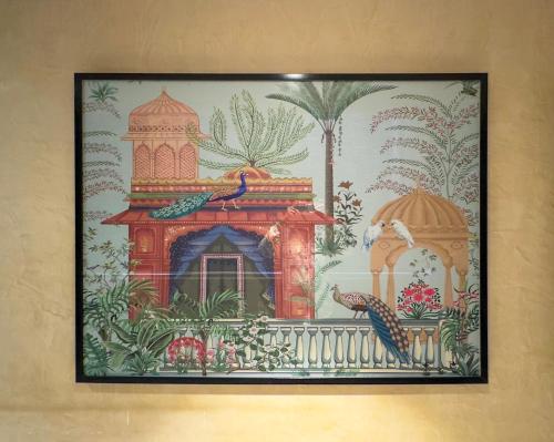 a tapestry hanging on a wall in a room at WoodApple Residency in New Delhi