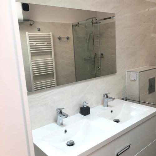 a bathroom with a sink and a mirror at Ferienhaus Luka in Zadar